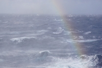 Stormy_waters_rainbow.JPG